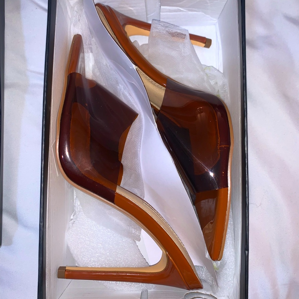 Brown mule heels with clear toe. Brand is Liliana.